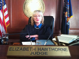 I play Judge Elizabeth Hawthorne in REVENGE